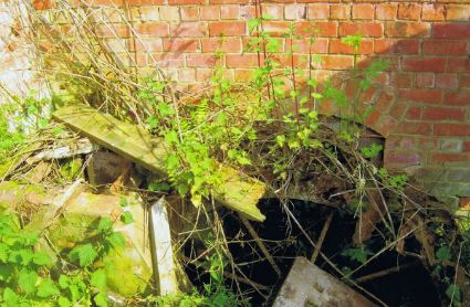 What remains of the metal wheel turned by water from the sluice that powered the water pump