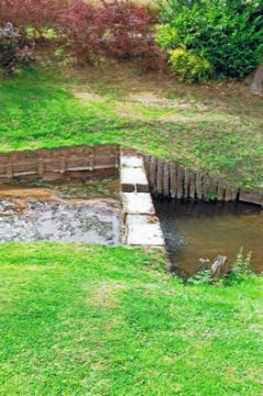 Dam & Brook Showing Bridge Over Road